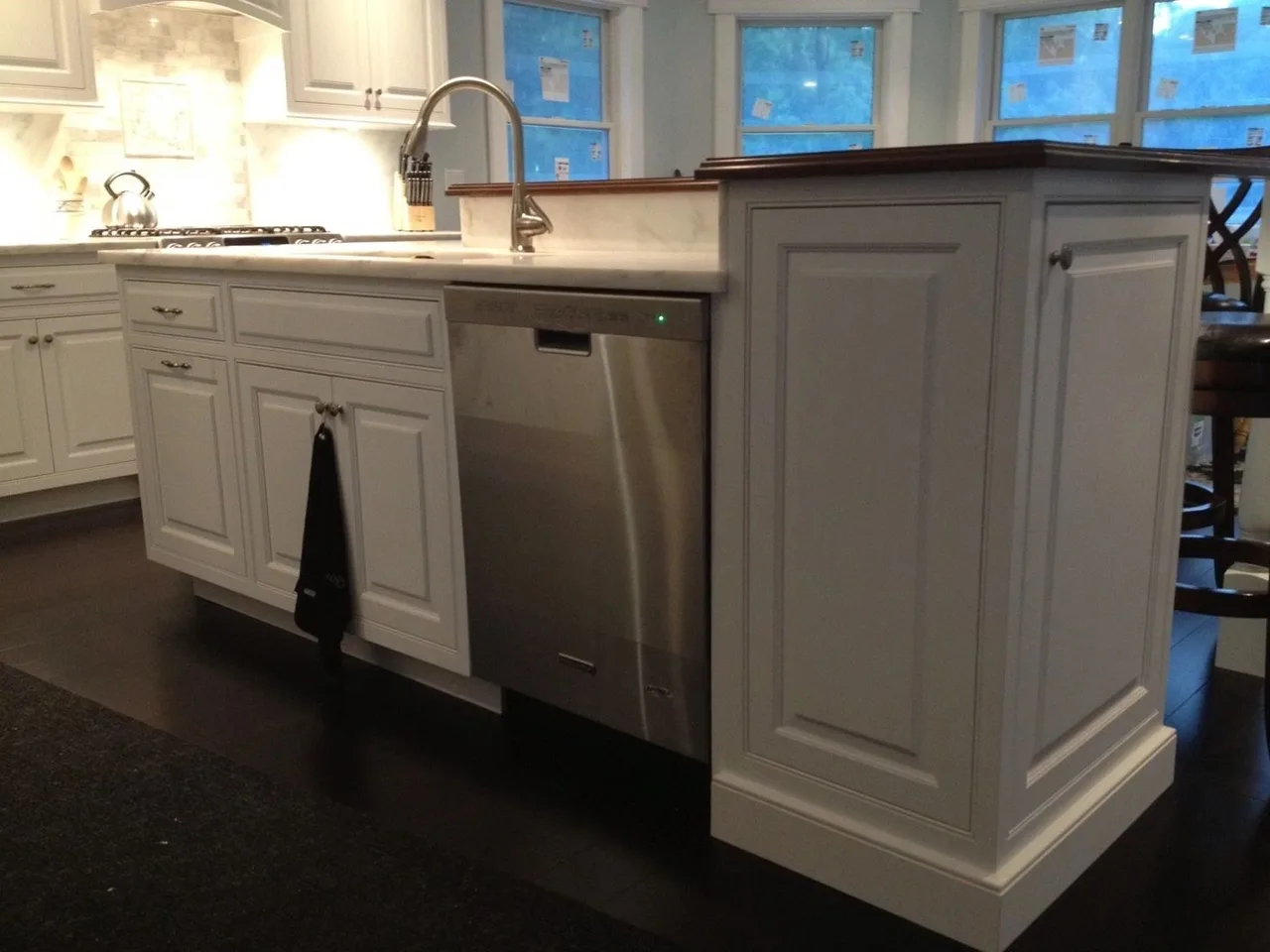 white kitchen corner with dishwasher, dark floor, Kitchens & Vanities